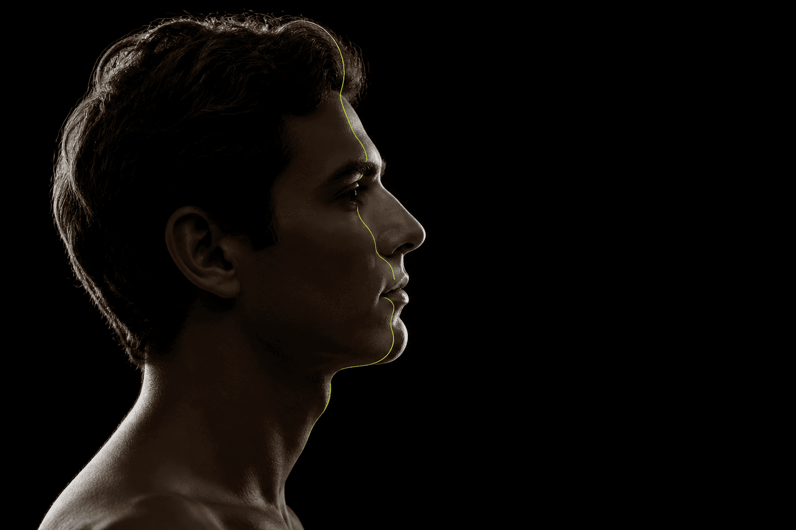 An actor in profile with a thin lime calibration line crossing the face.
