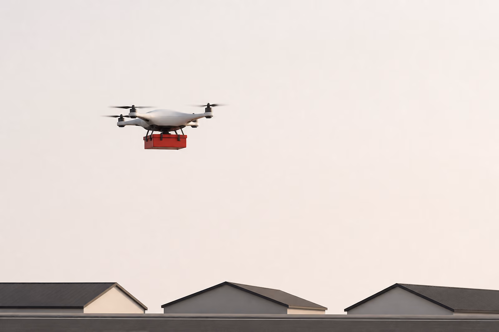 A single autonomous drone carrying a red medical package above a quiet suburban street.